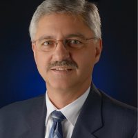 geoff headshot blue tie